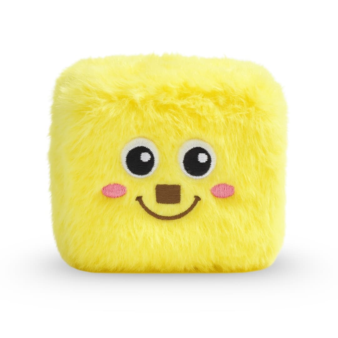 Soft yellow plush dog toy cube with embroidered smiling face and fuzzy texture, ideal for small to medium dogs.