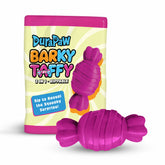 A packaging of Durapaw Barky Taffy showing a candy-shaped dog toy with a plush exterior in purple and orange, and a rubber chew toy inside.