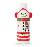 Crunchy the Snowman dog toy with red earmuffs, scarf, penguin design, and striped base