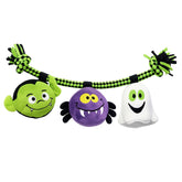 Halloween-themed rope dog toys with a green monster, purple spider, and white ghost on a black and green rope.
