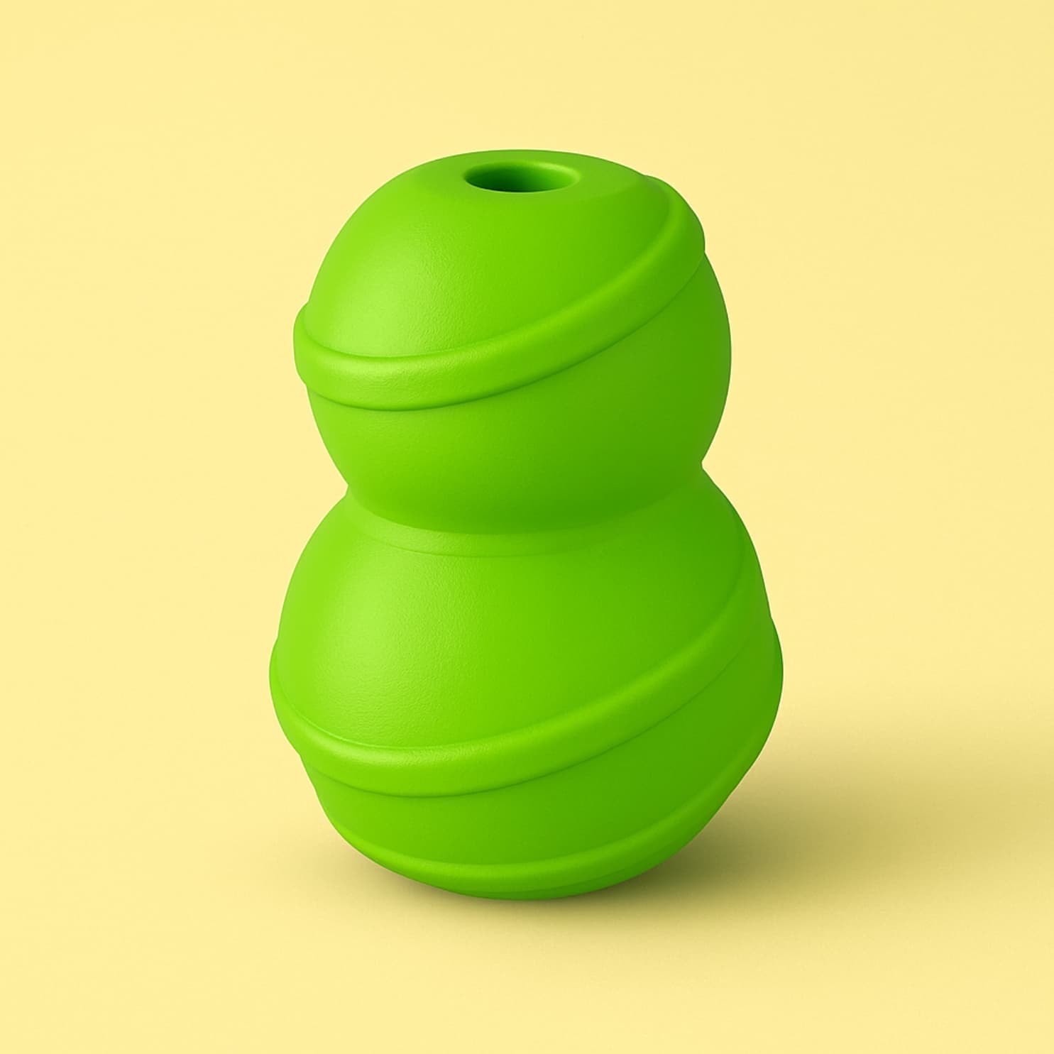 Bright green snowman-shaped dog toy made of rubber, sitting upright against a light yellow background.